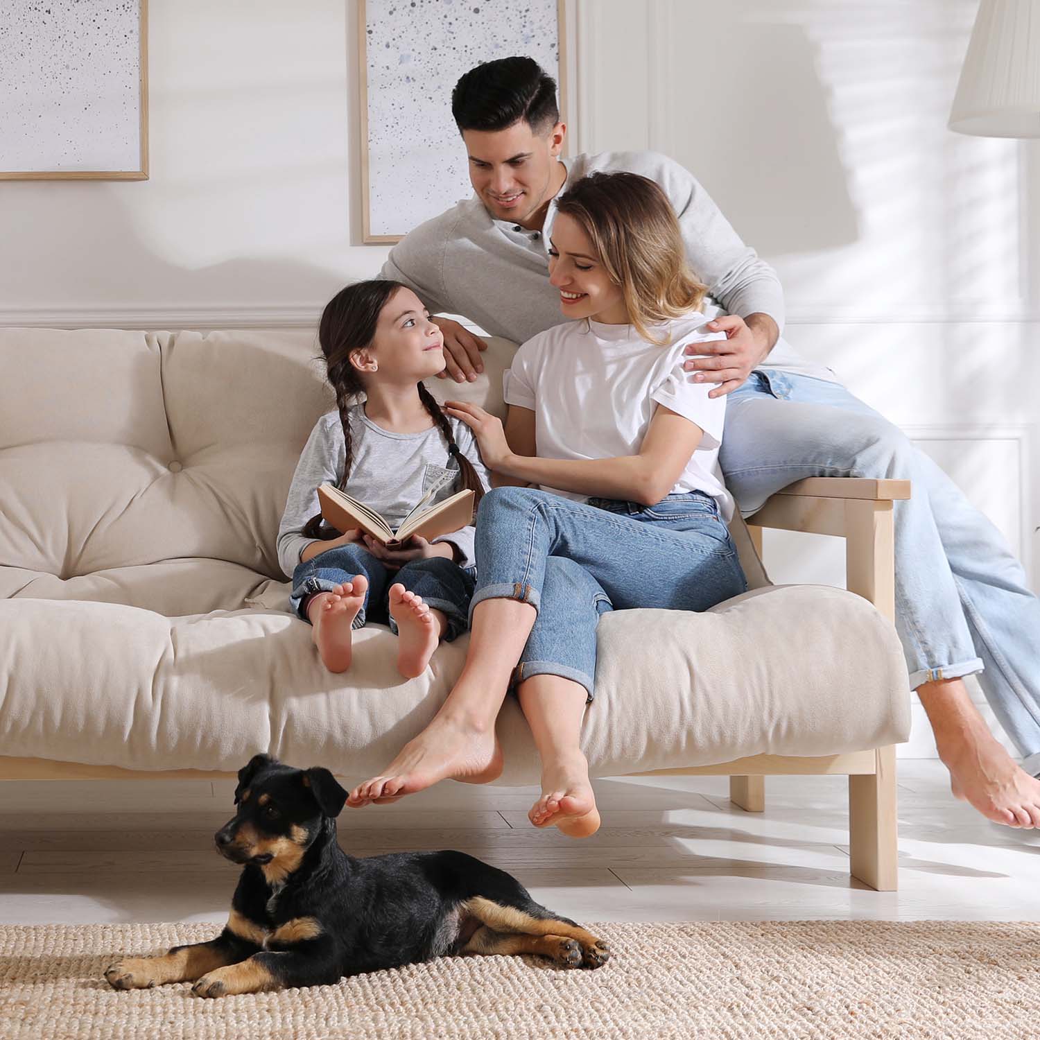 A family relaxing at home with their healthy puppy