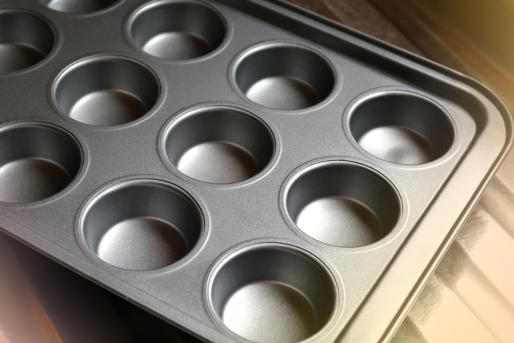 All you need is a clean, empty muffin pan or cupcake pan to make a fun mentally challenging games for dogs. 